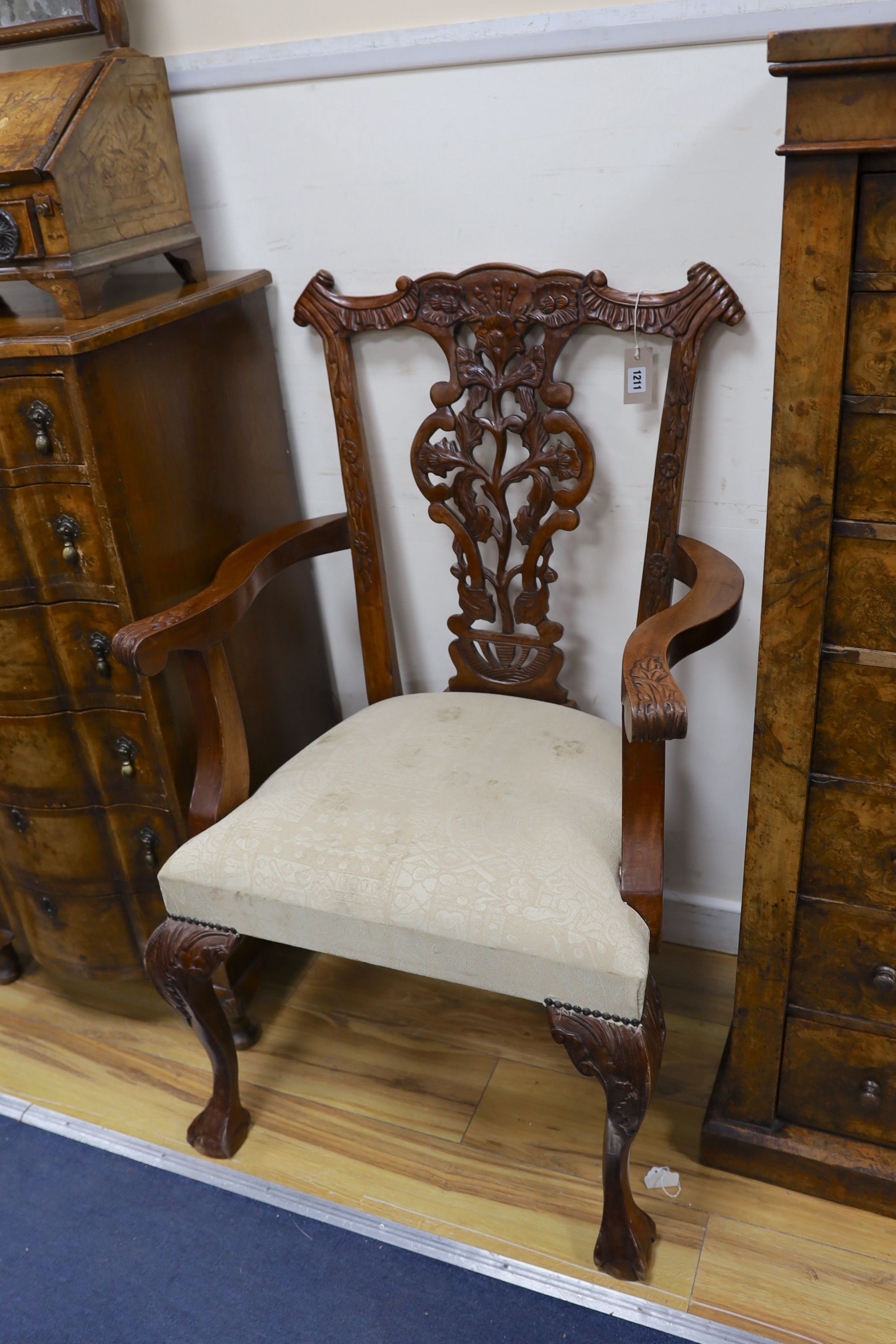 A pair of Chippendale style mahogany elbow chairs, width 67cm, depth 57cm, height 106cm